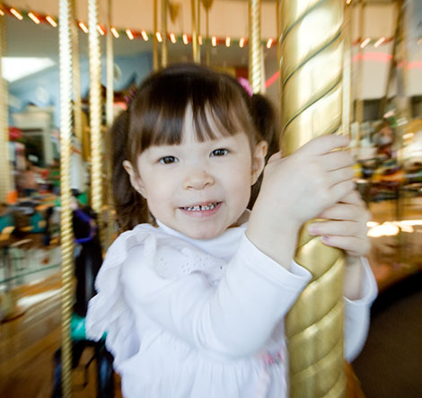 Kadie on the carousel for her birthday