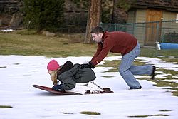 Sliding on the snow outside the condo