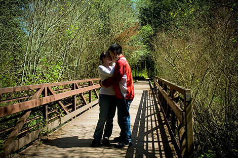 Crossing a bridge, but not before celebrating with a kiss.