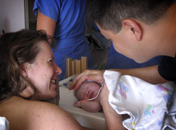 Jenni touching Kadence before NICU transfer