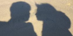 Our shadows closing in for a kiss